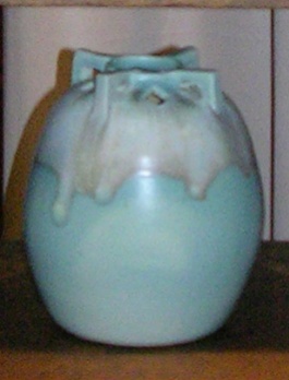 Gourd shape vase with cutouts and handles